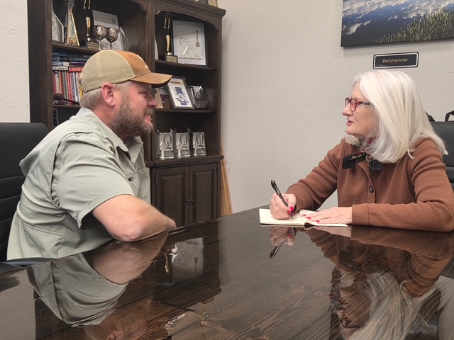 Susan visiting with a constituent.